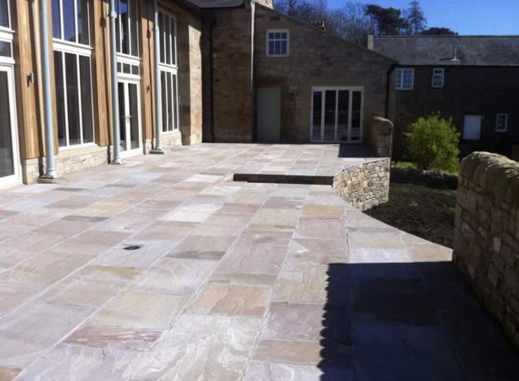 Professional outside tap installation in garden setting